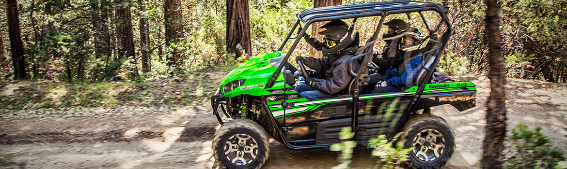 Four people take a ride in a 2017 Kawasaki Teryx4™ side by side